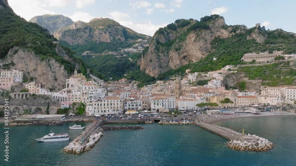 Aerial: Slow panning panoramic drone shot of Amalfi village in Italy Aerial: Slow panning panoramic drone shot of Amalfi village in Italy