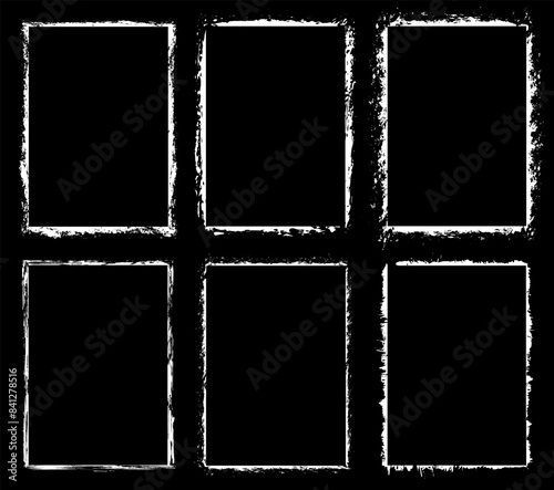Set of abstract empty borders. Grunge background. Isolated white frames for photo or text on black background. Scratched and damaged vintage borders. Vector image.