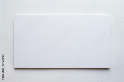 Photo of a blank white foam board sign placed outdoors. photo