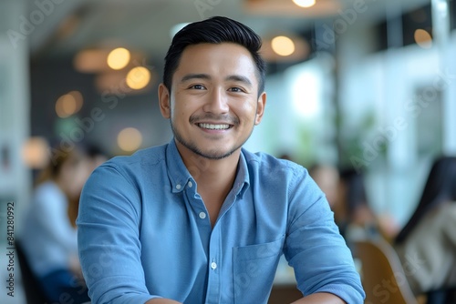 Portrait of male Filipino handsome business leader, modern bright office boardroom, professional atmosphere, leadership, diverse workplace, corporate setting.