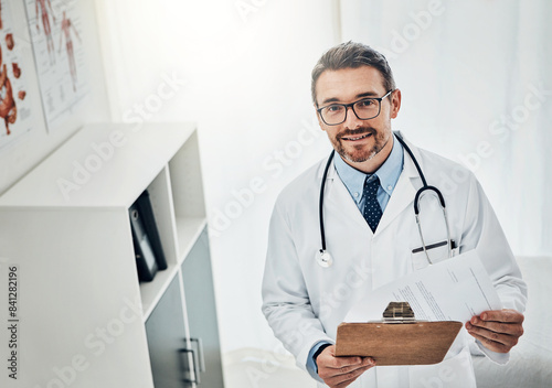 Portrait  man or doctor in clinic with clipboard  healthcare and confidence with hospital schedule. Admin  paperwork and medical professional with document  chart or application for health insurance
