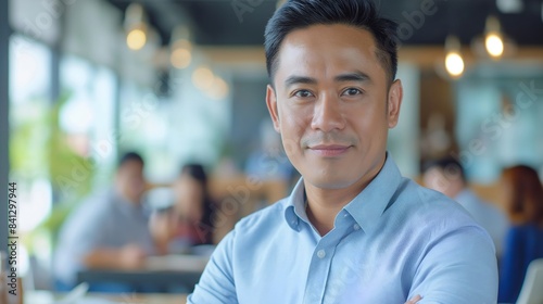 Portrait of male Filipino handsome business leader, modern bright office boardroom, professional atmosphere, leadership, diverse workplace, corporate setting.