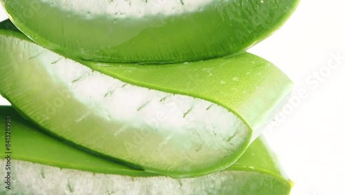 Aloe vera cut into small pieces on a white background