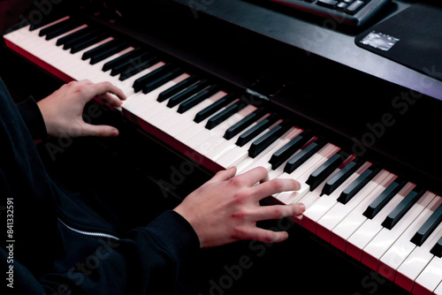 close up in the recording room dark studio sound engineer while playing  records the sound of synthesizer selecting the desired k