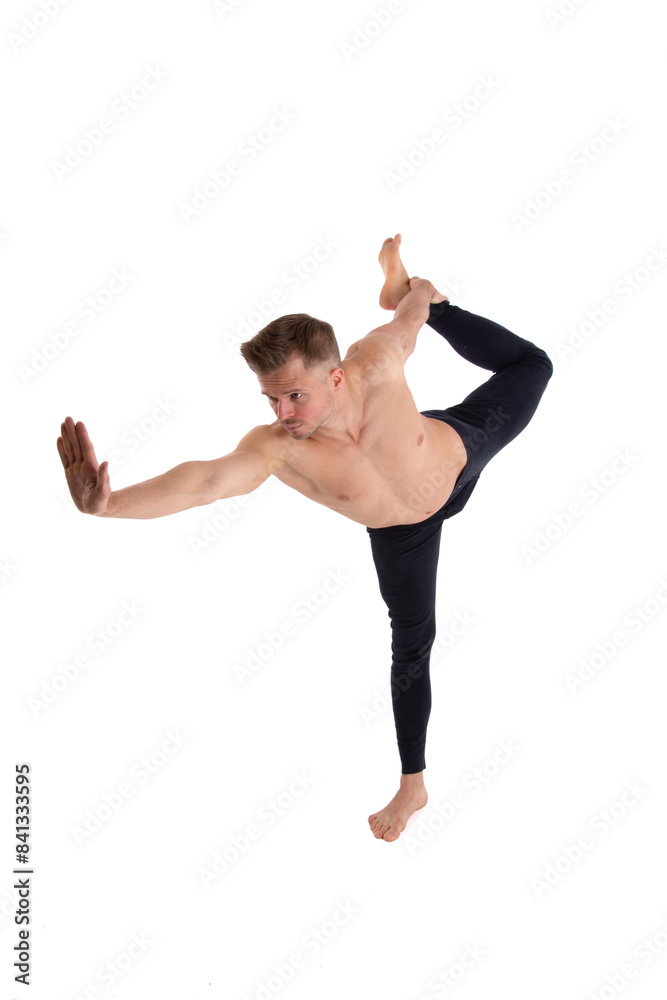 Fitness and Yoga. Healthy lifestyle. Young attractive man posing in the studio. White background. Fitness and Yoga. Healthy lifestyle. Young attractive man posing in the studio. White background.