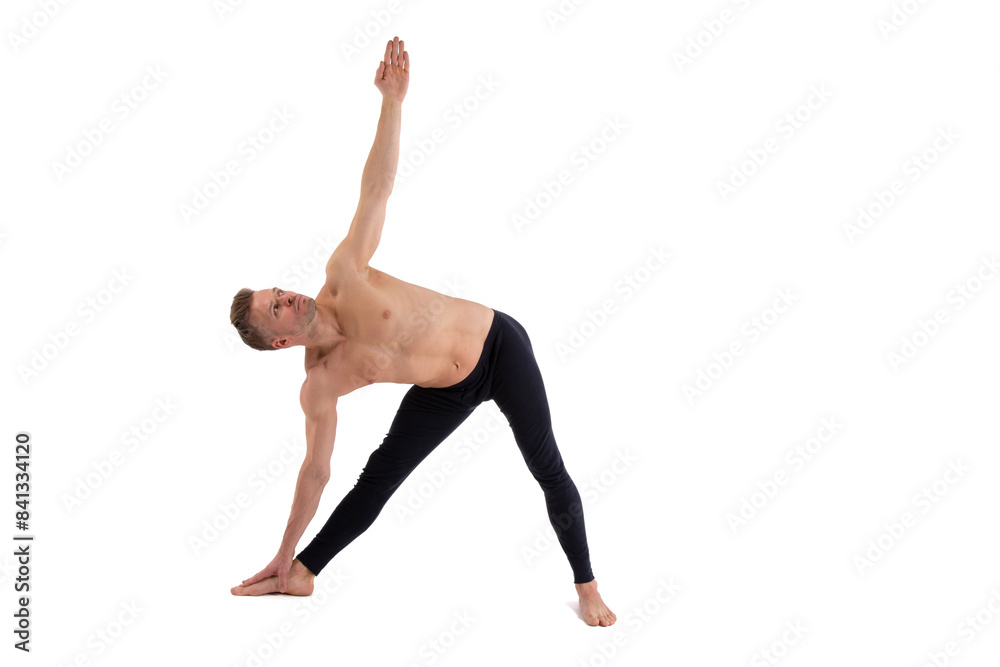 Fitness and Yoga. Healthy lifestyle. Young attractive man posing in the studio. White background. Fitness and Yoga. Healthy lifestyle. Young attractive man posing in the studio. White background.