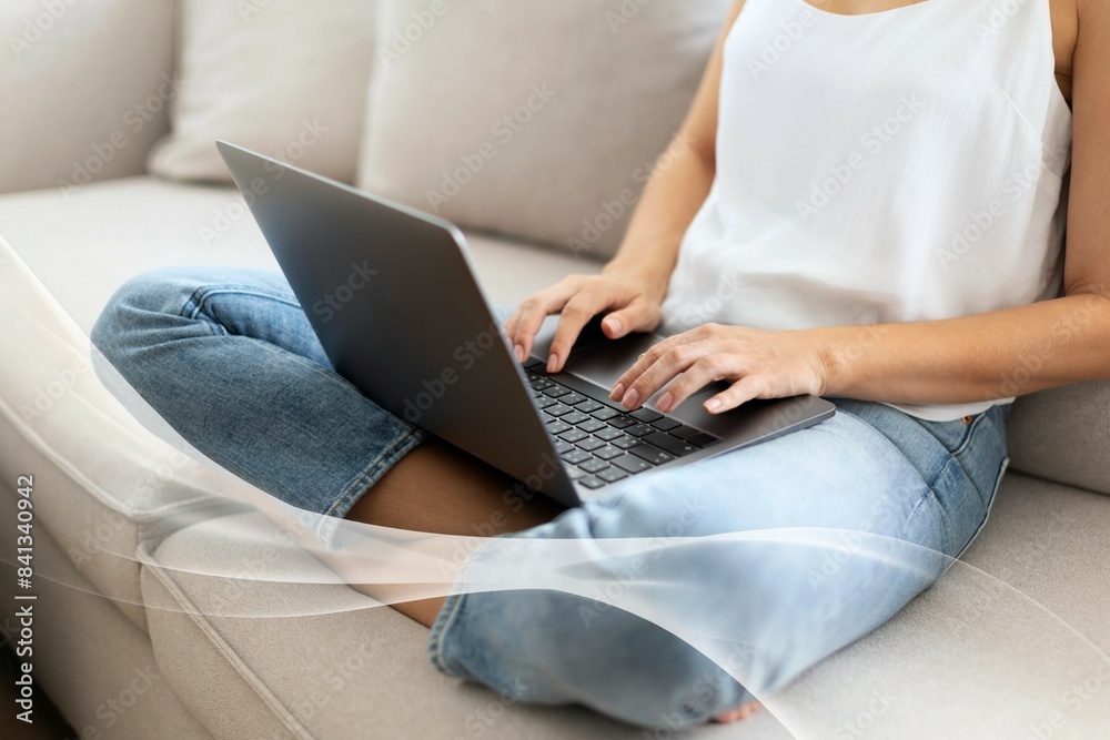 Fototapeta premium Woman working at home in a Scandinavian decor living room