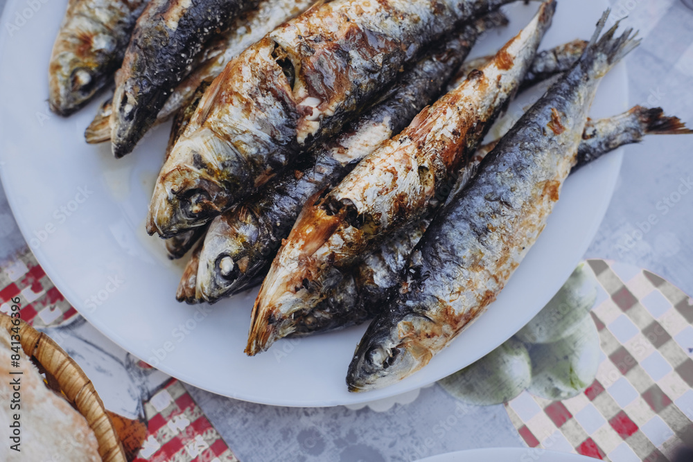 Grilled sardines on a plate, All Saints, 'Santos Populares' holidays in Lisbon in June Grilled sardines on a plate, All Saints, 'Santos Populares' holidays in Lisbon in June