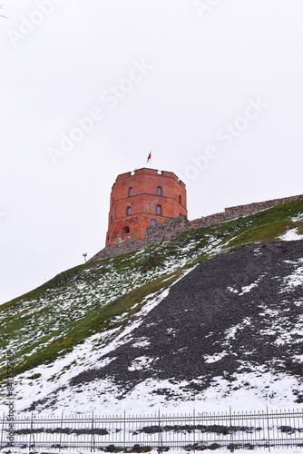 Vilnius, Lithuania - December 24, 2022: Gediminas Tower on the hill in the old town centre in Vilnius, Lithuania. The tower is an important state and historic symbol of the city of Vilnius. 