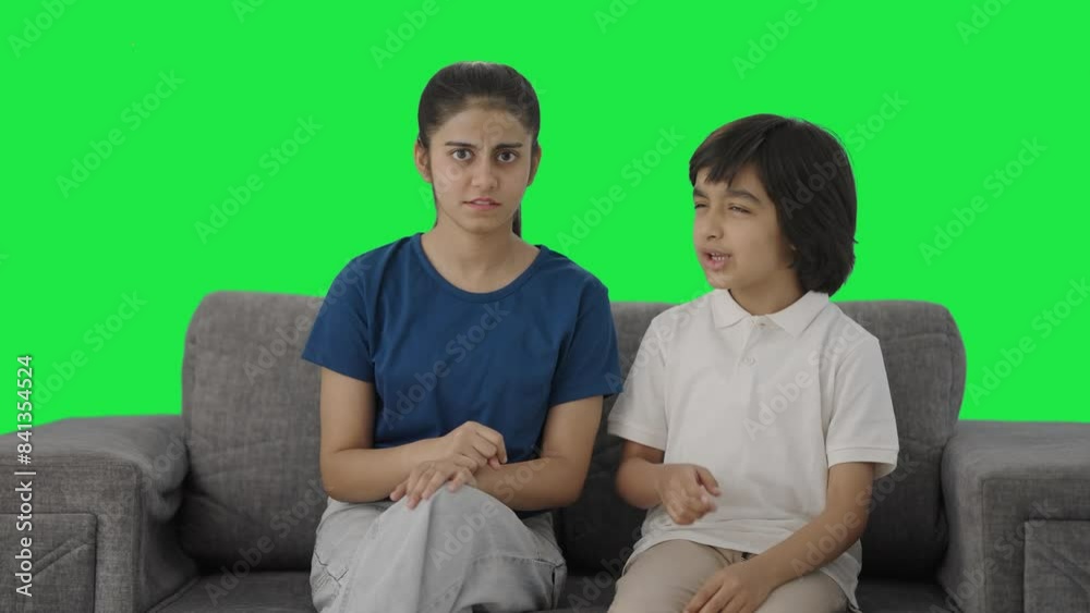 Angry Indian siblings fighting to the camera Green screen Angry Indian siblings fighting to the camera Green screen