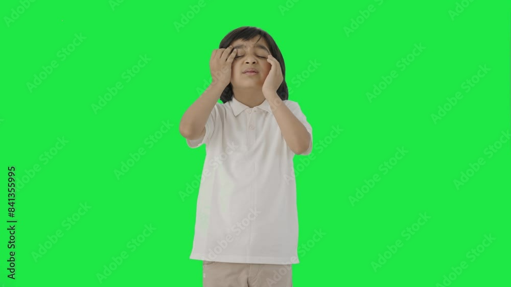 Sick Indian boy having a headache Green screen Sick Indian boy having a headache Green screen
