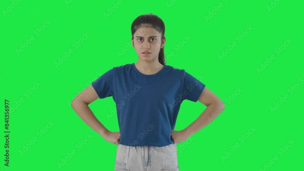 Angry Indian teenage girl staring at the camera Green screen Angry Indian teenage girl staring at the camera Green screen