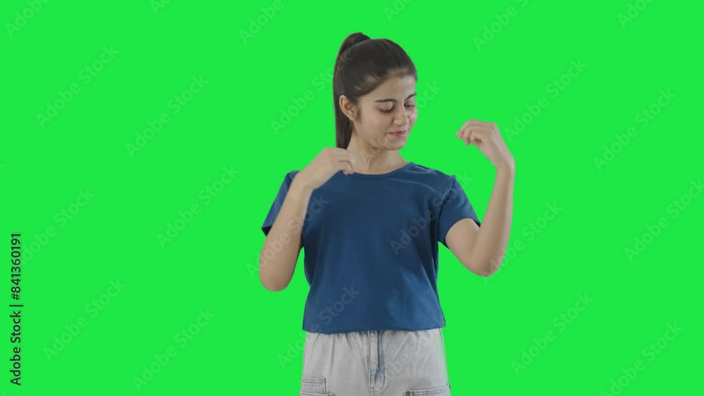 Happy Indian teenage girl getting ready for going out Green screen Happy Indian teenage girl getting ready for going out Green screen