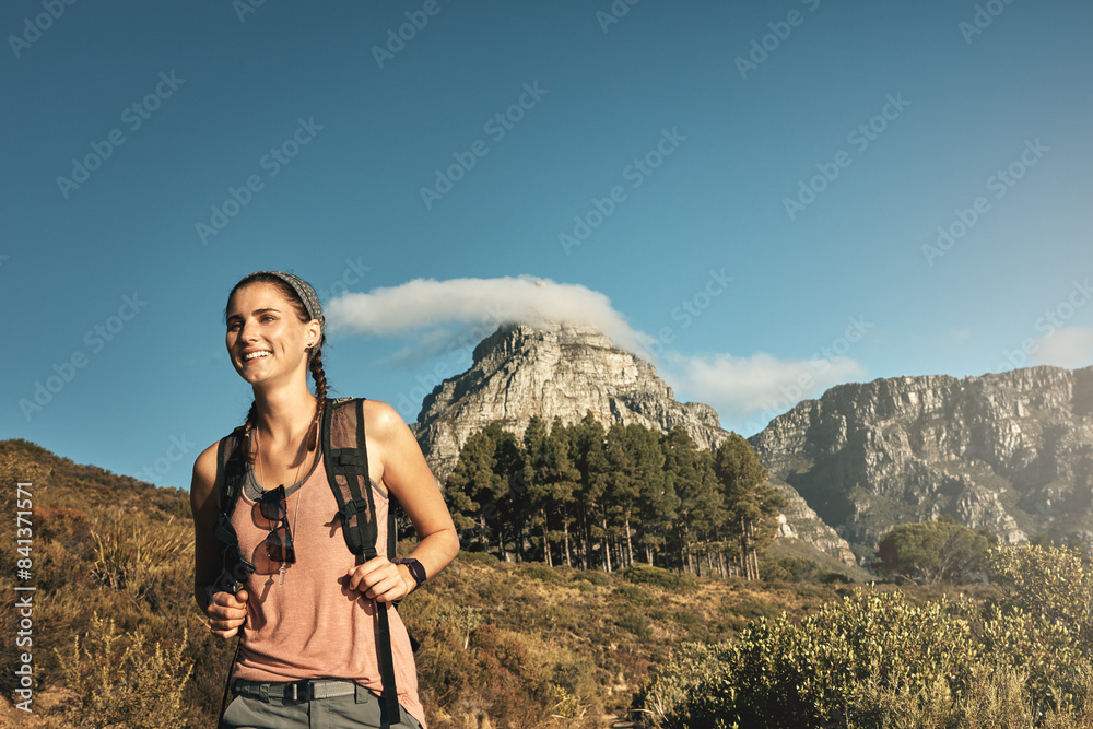 Naklejka premium Adventure, hiking and woman with nature, fitness and outdoor for hobby, wellness or journey. Person, hiker or healthy girl with environment, mountain or cardio with vacation, wellness or getaway trip
