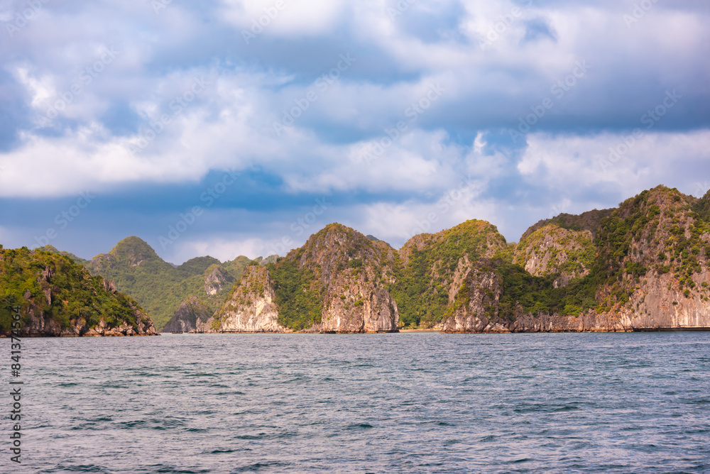 Many small islands in sea bay in Vietnam with boats Many small islands in sea bay in Vietnam with boats