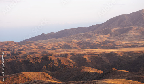 Autumn landscape of vast plains in China. Breathtaking, amazing, endless desert mountain landscapes bordering the Gobi Desert.