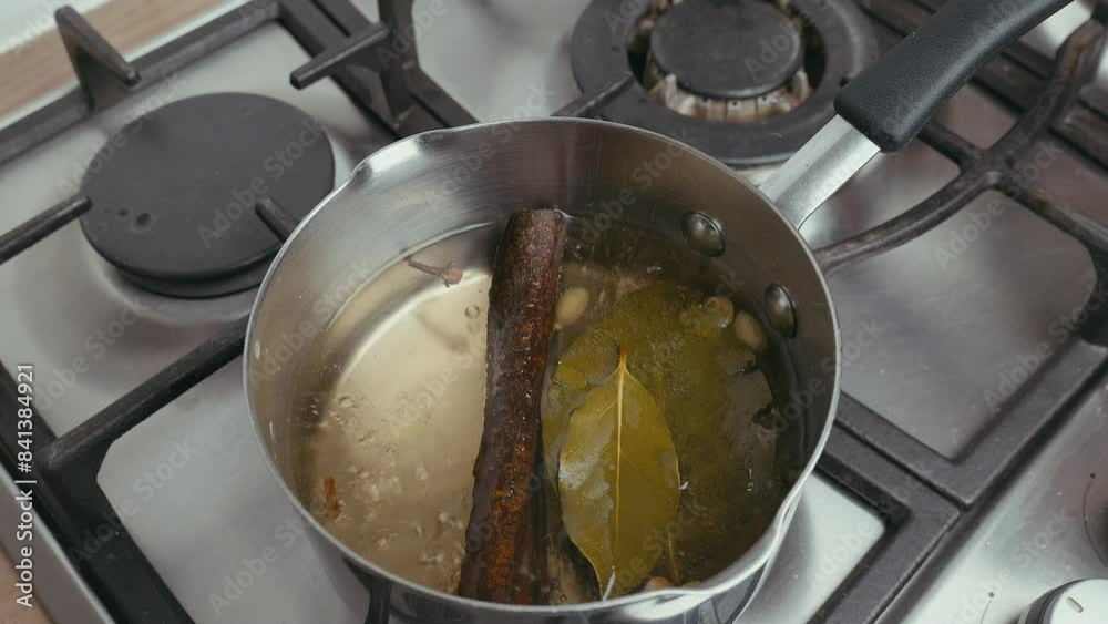 Cooking Video. Close up of food cooking simmering in a pan full of curry sauce, soup or stew placing ingredients herbs spices pan ready for cooking. Happy household chores healthy eating concept. Cooking Video. Close up of food cooking simmering in a pan full of curry sauce, soup or stew placing ingredients herbs spices pan ready for cooking. Happy household chores healthy eating concept.