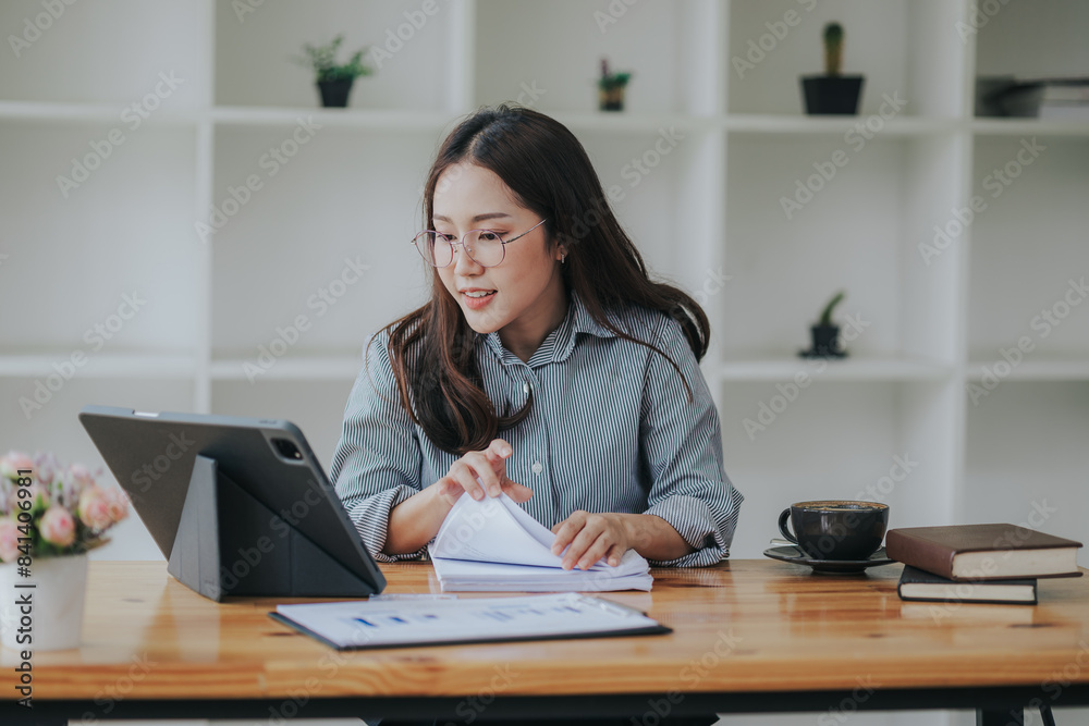 Accountant calculating tax and income working in office Accountant calculating tax and income working in office