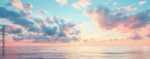 The sunset sky is a beautiful blue and pink color, with beautiful colors over the sea.
