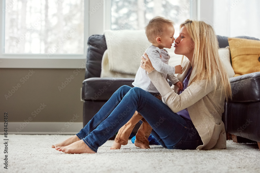 Home, fun and kiss of baby by mom, living room and playful with son, love and care in apartment. House, mother and toddler in lounge, hug and together on floor, happiness and wellness for boy Home, fun and kiss of baby by mom, living room and playful with son, love and care in apartment. House, mother and toddler in lounge, hug and together on floor, happiness and wellness for boy