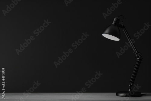 With a table and a white lamp against a black textured wall, this minimalistic presentation background will surely wow your audience. photo