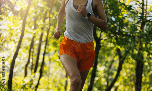 Photography Woman runner running on forest trail