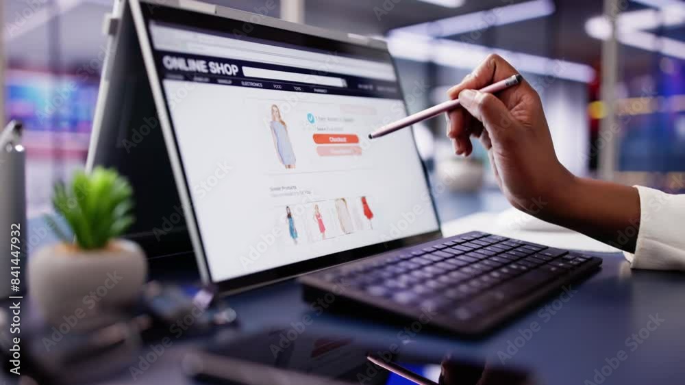 African American Woman Online Shopping for Luxury Clothes on Laptop Screen: Digital Marketing Professional