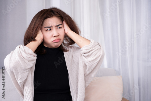 auditory hallucination concept with Asian woman hearing voices due to mental illnesses, drug side effects, and physical health problems