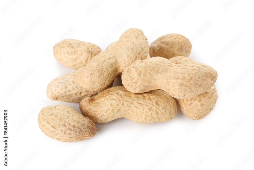 Pile of fresh unpeeled peanuts isolated on white Pile of fresh unpeeled peanuts isolated on white