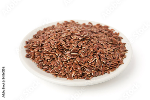 Brown flax seeds on white plate isolated on white background. Brown Flax Seed is rich in nutrients such as dietary fiber and essential fatty acids that are beneficial to the body.
