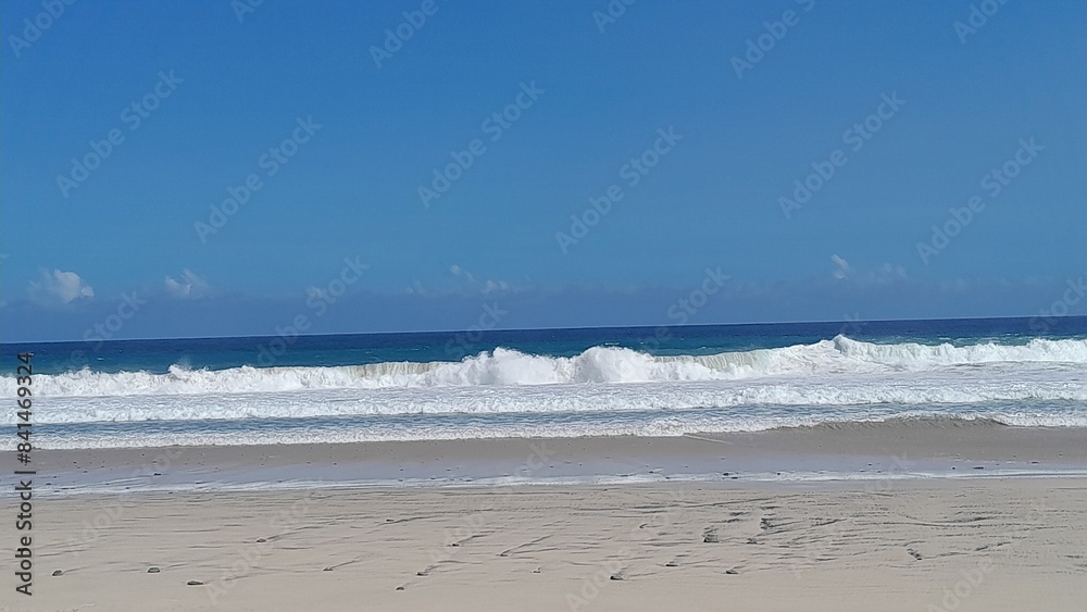 Beautiful beach with waves breaking on the rocks, Malang Modangan, East Java, Indonesia Beautiful beach with waves breaking on the rocks, Malang Modangan, East Java, Indonesia