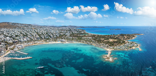 Aerial view of the Asteras Beach in Glyfada, south Athens suburb, Greece, with turquoise sea and urban skyline