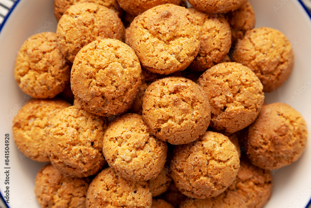 Homemade Sweet and Crunchy Amaretti on a Plate, top view. Flat lay, overhead, from above. Close-up. Homemade Sweet and Crunchy Amaretti on a Plate, top view. Flat lay, overhead, from above. Close-up.