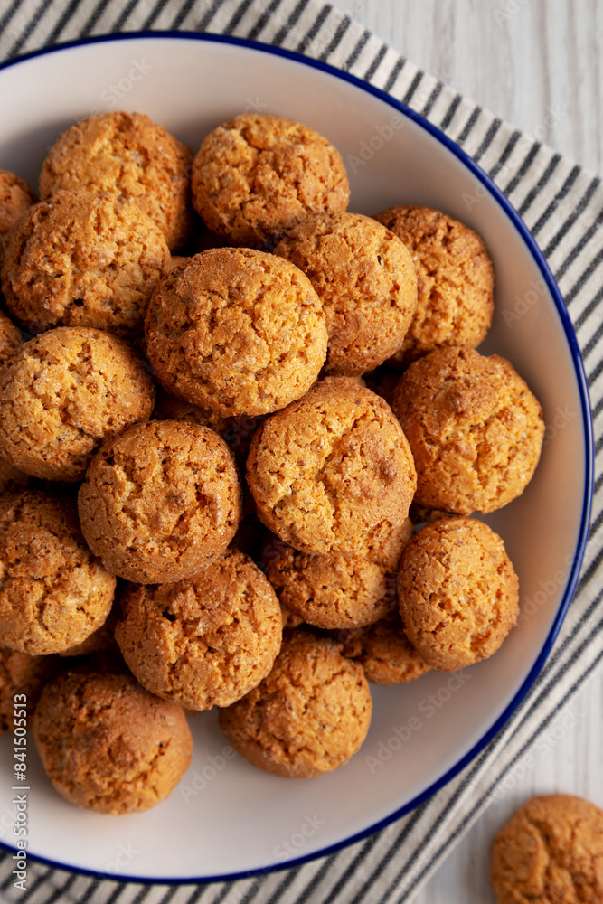 Homemade Sweet and Crunchy Amaretti on a Plate, top view. Flat lay, overhead, from above. Close-up. Homemade Sweet and Crunchy Amaretti on a Plate, top view. Flat lay, overhead, from above. Close-up.