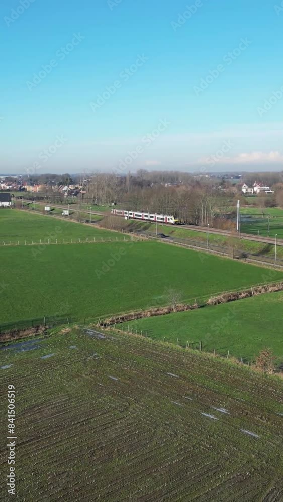 Train Chasing Tracking fields rural countryside passenger train railway Train Chasing Tracking fields rural countryside passenger train railway