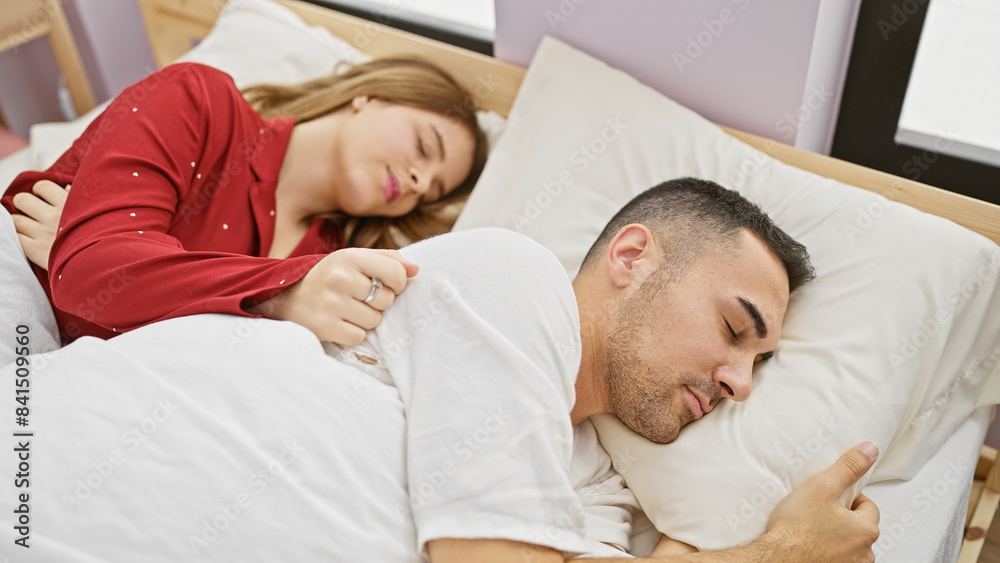 A couple sleeps peacefully in a cozy bedroom, embodying love, togetherness, and the comfort of home.