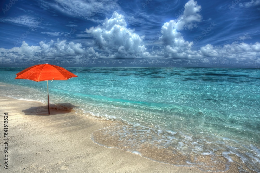 A bright orange umbrella sits on the surface of a sunny sandy beach, with no one in sight A bright orange umbrella sits on the surface of a sunny sandy beach, with no one in sight