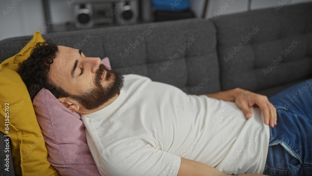 Relaxed man napping on a couch in a cozy living room, embodying leisure and domestic tranquility. Relaxed man napping on a couch in a cozy living room, embodying leisure and domestic tranquility.