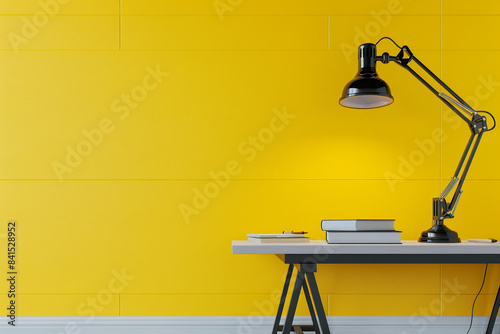 A modern office setup featuring a minimalist table and lamp against a vibrant yellow wall, inspiring productivity and creativity in a bright and energetic environment.