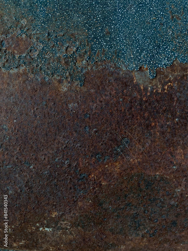 Rust on the steel wall looks like an art painting. On the right side there was a small ball hanging down. The left side has a large rust stripe.
