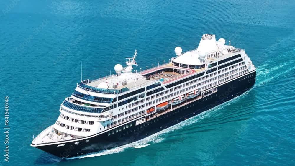 Cruise ship sailing across The Mediterranean sea - Aerial footage. Luxury cruise in the ocean sea concept tourism travel on holiday take a vacation time on summer. Cruise ship sailing across The Mediterranean sea - Aerial footage. Luxury cruise in the ocean sea concept tourism travel on holiday take a vacation time on summer.