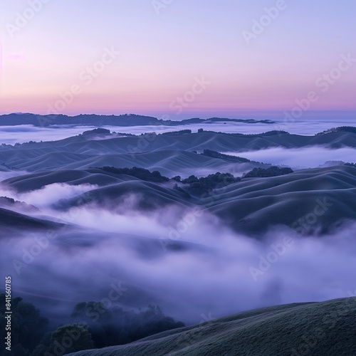 A panoramic view of rolling hills covered in a blanket of fog at dawn  with the tops of the hills peeking through the mist  creating a serene and mystical landscape.