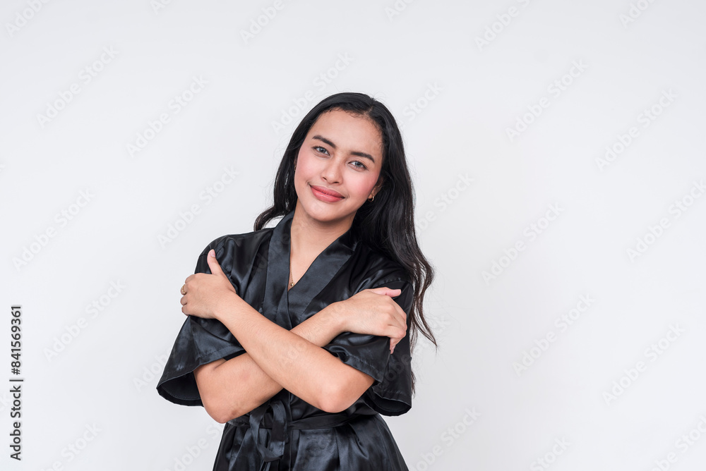 Asian woman in black silk bathrobe embracing herself Asian woman in black silk bathrobe embracing herself