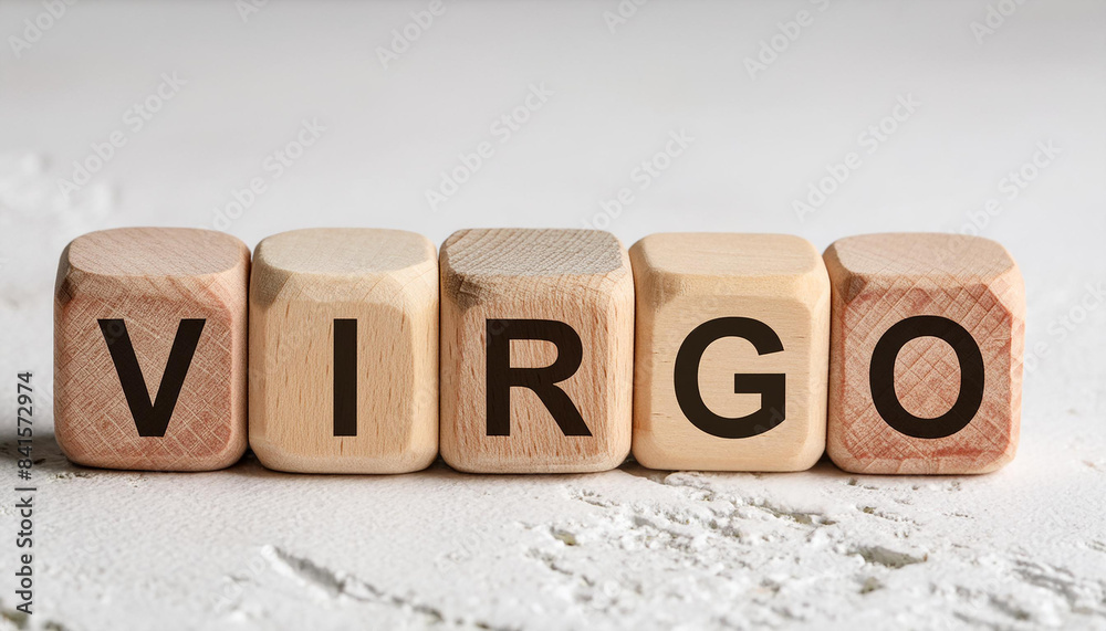 Wood cubes with text VIRGO on light surface. Zodiac signs and astrology concept. Wood cubes with text VIRGO on light surface. Zodiac signs and astrology concept.