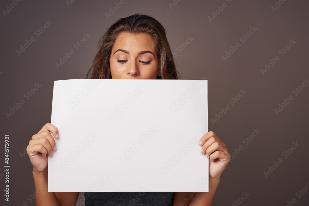 Woman, poster and studio background for instruction with mockup space for advertising, marketing and tips. Female person, sign board and presentation with promotion, information and paper card Woman, poster and studio background for instruction with mockup space for advertising, marketing and tips. Female person, sign board and presentation with promotion, information and paper card