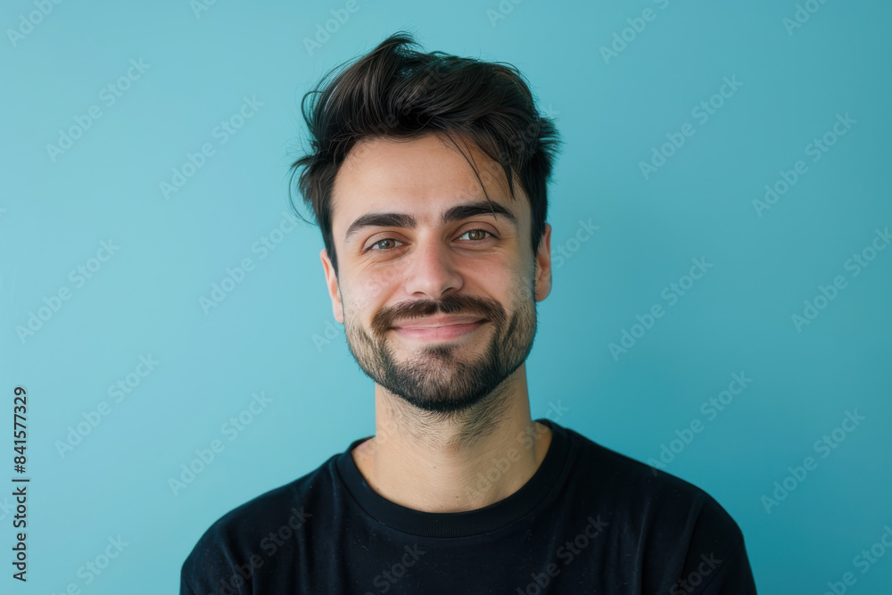 Fototapeta premium A close up portrait of a young man with a subtle smile