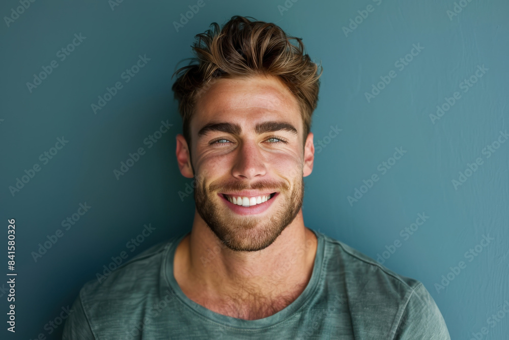 A close up portrait of a young man with a subtle smile A close up portrait of a young man with a subtle smile