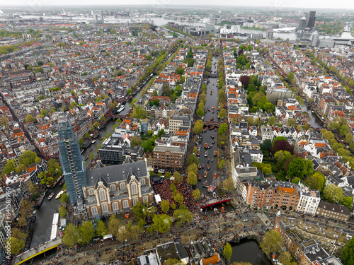 Kings Day 2024 in Amsterdam. Koningsdag, Koeningsdag in Capital of the Netherlands, Aerial Drone Fly Over Orange Suits.
