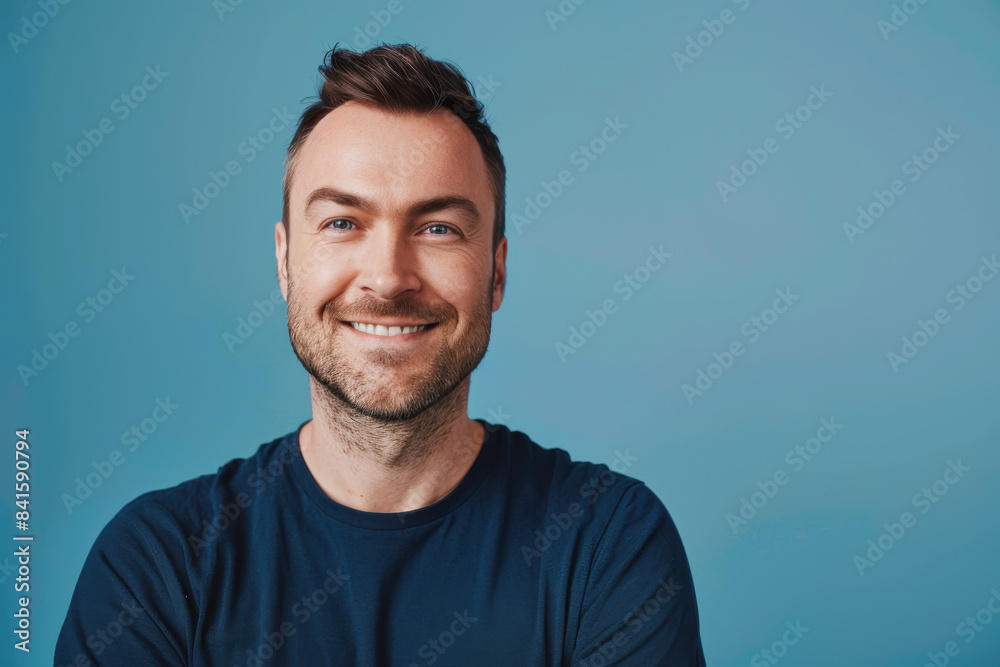 A close up portrait of a young man with a subtle smile A close up portrait of a young man with a subtle smile