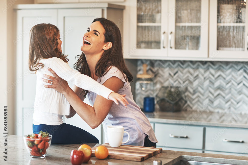 Obraz premium Happy, mother and hug with girl, kitchen counter or bonding in weekend, house and kid with smile. Home, child and mom with daughter, embrace and together in morning, peace or love in apartment